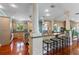 Kitchen boasts island, granite countertops, and hardwood floors at 800 W 2Nd Ave, Windermere, FL 34786