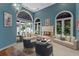 Spacious living room with fireplace and water views at 800 W 2Nd Ave, Windermere, FL 34786