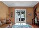 Office with hardwood floors, built-in shelving and lake views at 800 W 2Nd Ave, Windermere, FL 34786