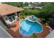 Inviting kidney-shaped pool with a fountain and ample patio space at 800 W 2Nd Ave, Windermere, FL 34786