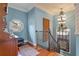 Upstairs hall with stained glass window and hardwood floors at 800 W 2Nd Ave, Windermere, FL 34786