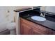 Bathroom with granite countertop and wood cabinets at 829 Camargo Way # 212, Altamonte Springs, FL 32714