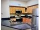 Kitchen with granite countertops and stainless steel appliances at 829 Camargo Way # 212, Altamonte Springs, FL 32714