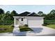 One-story home with a two-car garage and landscaped front yard at 3888 Sagefield Dr, Saint Cloud, FL 34773