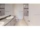 Modern bathroom with double vanity and soaking tub at 2090 Penn Dr, Deland, FL 32724