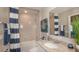 Cozy bathroom featuring a shower-tub combo and granite countertop at 605 N Boundary Ave, Deland, FL 32720