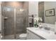 Modern bathroom with a walk-in shower and white vanity at 605 N Boundary Ave, Deland, FL 32720