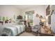 Cozy bedroom with a twin bed and woodland-themed decor at 605 N Boundary Ave, Deland, FL 32720