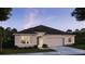 Single-story house with gray siding, gray roof, and attached garage at 605 N Boundary Ave, Deland, FL 32720