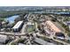 An aerial view of the apartment complex, located near a lake and features multiple residential buildings at 4424 S Texas Ave, Orlando, FL 32839