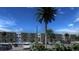 Modern apartment building with ample parking, mature palm trees, and well-manicured landscaping at 4424 S Texas Ave, Orlando, FL 32839