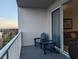 Balcony with two chairs and stunning water views at 13427 Blue Heron Beach Dr # 702, Orlando, FL 32821