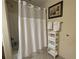 Clean bathroom with shower, tub, and plenty of towels at 13427 Blue Heron Beach Dr # 702, Orlando, FL 32821