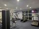 Well-equipped fitness center with treadmills, elliptical trainers, and weight machines at 13427 Blue Heron Beach Dr # 702, Orlando, FL 32821