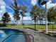 Community pool with lake view at 13427 Blue Heron Beach Dr # 702, Orlando, FL 32821