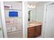 Bathroom with granite counters, a single sink, and ample storage at 3001 Sunset Vista Blvd, Kissimmee, FL 34747