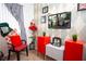 Themed bedroom with whimsical decorations and a wall-mounted TV, complemented by vibrant red and white accents at 3001 Sunset Vista Blvd, Kissimmee, FL 34747