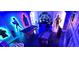 Unique game room with Star Wars characters, a pool table, and a foosball table, all under vibrant blue lighting at 3001 Sunset Vista Blvd, Kissimmee, FL 34747