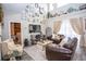 Inviting living room featuring a vaulted ceiling, decor accents, and abundant natural light at 3001 Sunset Vista Blvd, Kissimmee, FL 34747