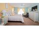 Bright bedroom with colorful accents, dresser, and comfortable seating at 3001 Sunset Vista Blvd, Kissimmee, FL 34747