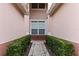 Brick walkway leads to the entrance of the townhome at 1323 Gilford Point Ln # 0, Davenport, FL 33896