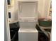 Stackable washer and dryer in a compact laundry room at 241 N Hill Ave, Deland, FL 32724