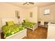 Bright and inviting bedroom with two twin beds, a desk for studying, and neutral décor at 1507 Tranquil Ave, Clermont, FL 34714