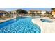 Community pool with lounge seating, clear blue water, and mature landscaping at 1507 Tranquil Ave, Clermont, FL 34714