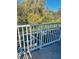Community pool view from the balcony, offering a peaceful retreat amidst lush greenery at 1507 Tranquil Ave, Clermont, FL 34714