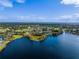 Expansive aerial view capturing the golf course community nestled along the waterfront at 6254 Masters Blvd # D106, Orlando, FL 32819