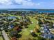 Beautiful aerial view of golf course homes, water features and lush landscaping at 6254 Masters Blvd # D106, Orlando, FL 32819