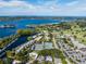 Panoramic aerial view showcasing the community's lakefront access, tennis courts, and marina at 6254 Masters Blvd # D106, Orlando, FL 32819