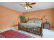 Bedroom featuring a ceiling fan and light walls to create a relaxing atmosphere at 6254 Masters Blvd # D106, Orlando, FL 32819