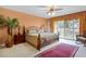 Bedroom featuring a spacious layout, light walls, and a sliding door leading to the outside at 6254 Masters Blvd # D106, Orlando, FL 32819