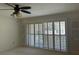 Bedroom with shutters, a ceiling fan, and closet doors at 6254 Masters Blvd # D106, Orlando, FL 32819