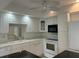 Bright kitchen with white cabinetry, modern appliances and island; a stylish space for culinary pursuits at 6254 Masters Blvd # D106, Orlando, FL 32819