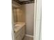 Half bath featuring wallpaper, updated sink, and under sink storage at 6254 Masters Blvd # D106, Orlando, FL 32819