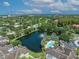 Overhead view of a community pond with palm trees, fountains and pool with a relaxing and serene atmosphere at 4865 Cypress Woods Dr # 2204, Orlando, FL 32811