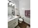 Bathroom features include a sink with white cabinetry, toilet, and towel rack at 4865 Cypress Woods Dr # 2204, Orlando, FL 32811