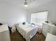 Cozy bedroom offers a relaxing retreat with a ceiling fan and plenty of natural light at 4865 Cypress Woods Dr # 2204, Orlando, FL 32811