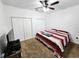 Bright bedroom features a ceiling fan and ample closet space for storage at 4865 Cypress Woods Dr # 2204, Orlando, FL 32811