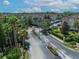 An inviting gated entrance to the Summergate community with lush palm trees and landscaping at 4865 Cypress Woods Dr # 2204, Orlando, FL 32811