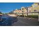 Exterior view of Summergate condominiums with parking, showing the community's architecture and parking facilities at 4865 Cypress Woods Dr # 2204, Orlando, FL 32811