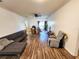 Spacious living room featuring modern flooring and ample natural light streaming through the windows at 4865 Cypress Woods Dr # 2204, Orlando, FL 32811