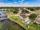 Aerial view showcasing lakefront living with private docks and lush surroundings at 10843 Lakeshore Dr, Clermont, FL 34711