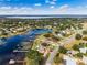 Areal view of waterfront homes with private docks and lush vegetation at 10843 Lakeshore Dr, Clermont, FL 34711