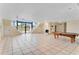 Large basement featuring tile floors, stairs, a fireplace and walkout access at 10843 Lakeshore Dr, Clermont, FL 34711