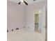 Bedroom with tile floors featuring a ceiling fan and an ensuite closet at 10843 Lakeshore Dr, Clermont, FL 34711