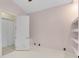 Cozy bedroom with white tile flooring, ceiling fan and closet at 10843 Lakeshore Dr, Clermont, FL 34711