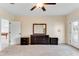 Carpeted bedroom featuring an additional room and an exterior access door at 10843 Lakeshore Dr, Clermont, FL 34711